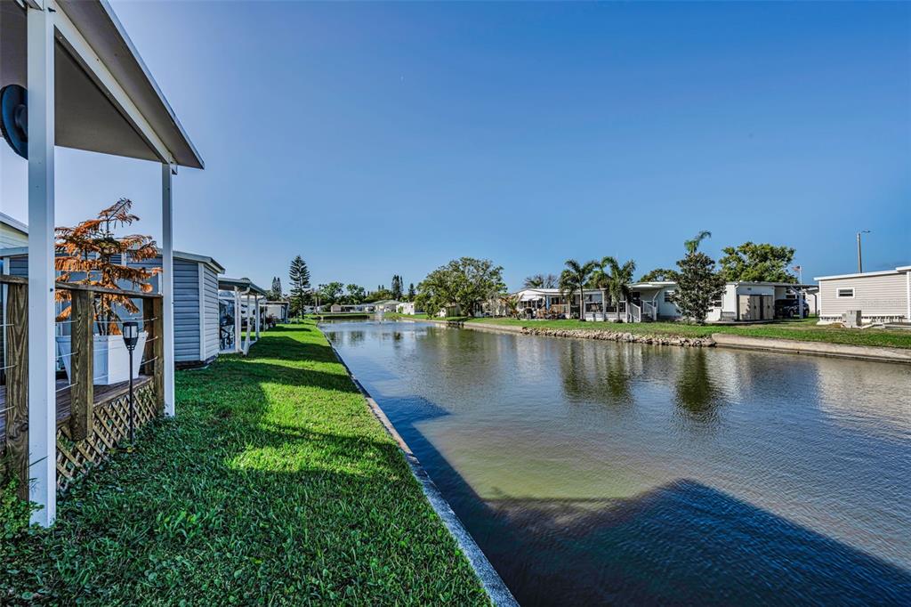 4454 Tucker Square New Port Richey, FL 34652 - Photo 38 of 64 a view of a lake with a house