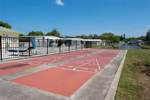 a view of a swimming pool with a patio
