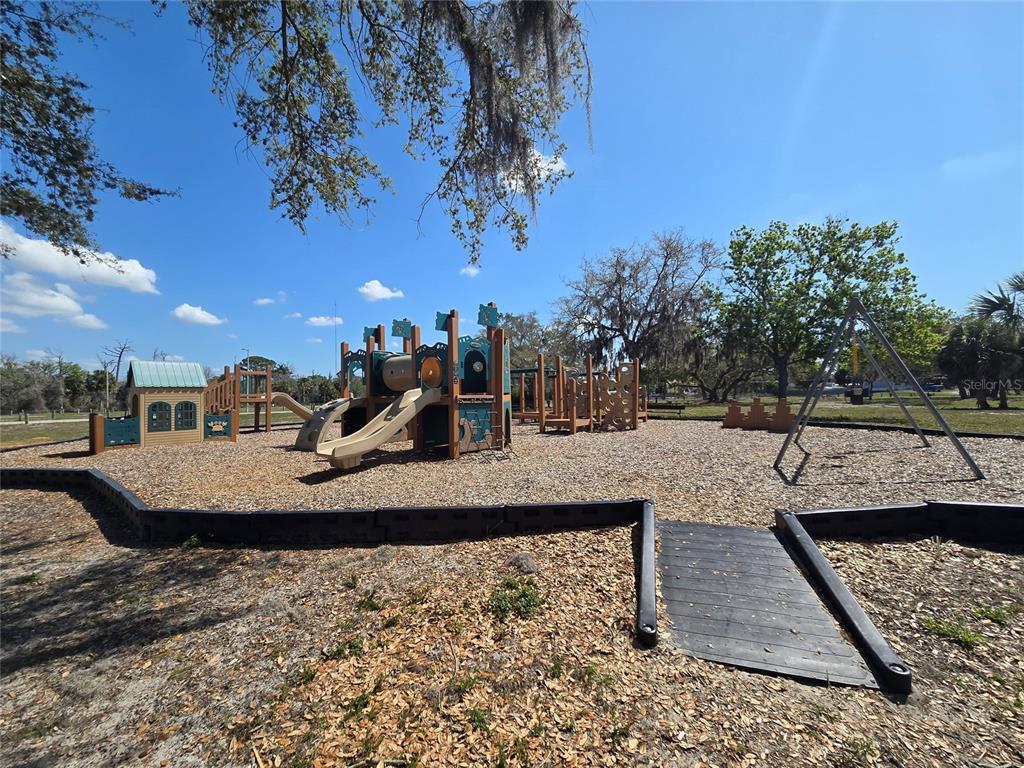 4454 Tucker Square New Port Richey, FL 34652 - Photo 55 of 64 a view of a swimming pool with a patio