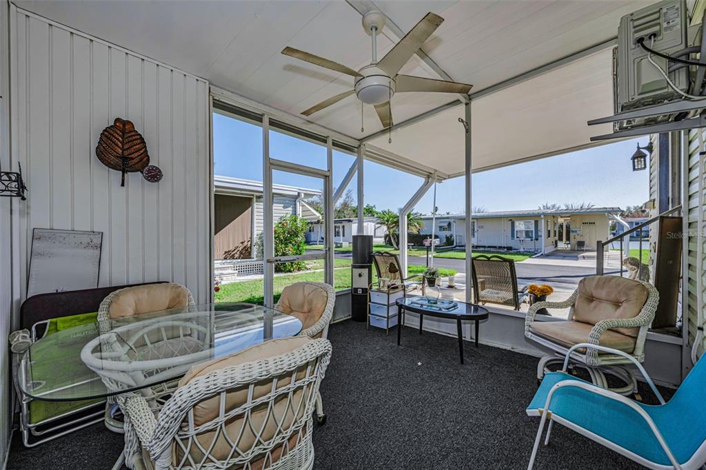 4454 Tucker Square New Port Richey, FL 34652 - Photo 9 of 64 a living room with furniture a ceiling fan and a window