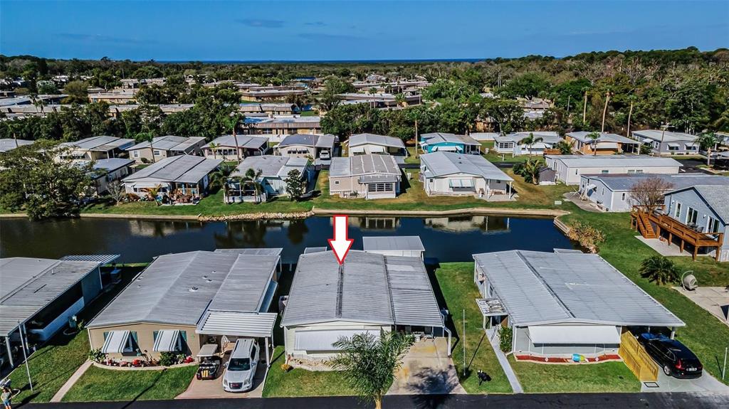 4454 Tucker Square New Port Richey, FL 34652 - Photo 10 of 64 an aerial view of multiple houses with a yard