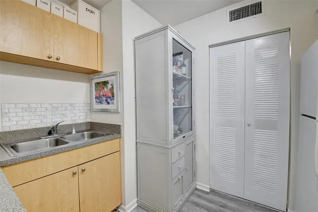 a bathroom with a sink and mirror