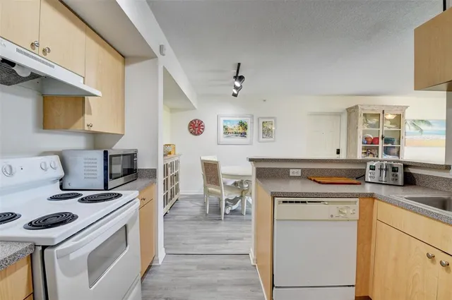 a kitchen with a stove and a sink