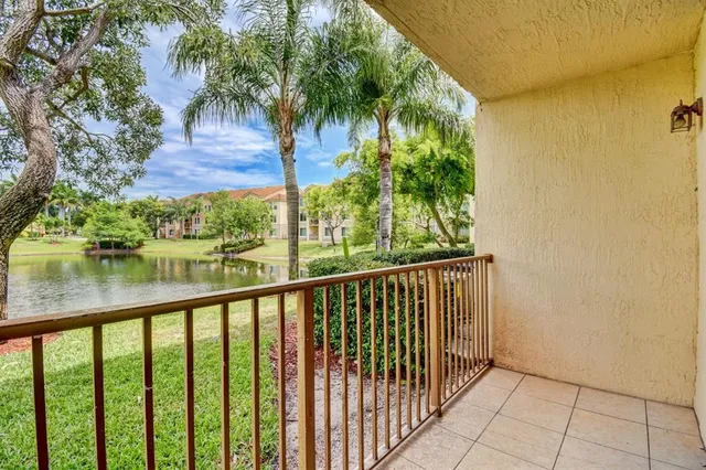 a view of balcony with yard