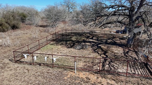 266 Catfish Lane Lockhart, TX 78644 - Photo 5 of 7 a view of a dry yard with wooden fence