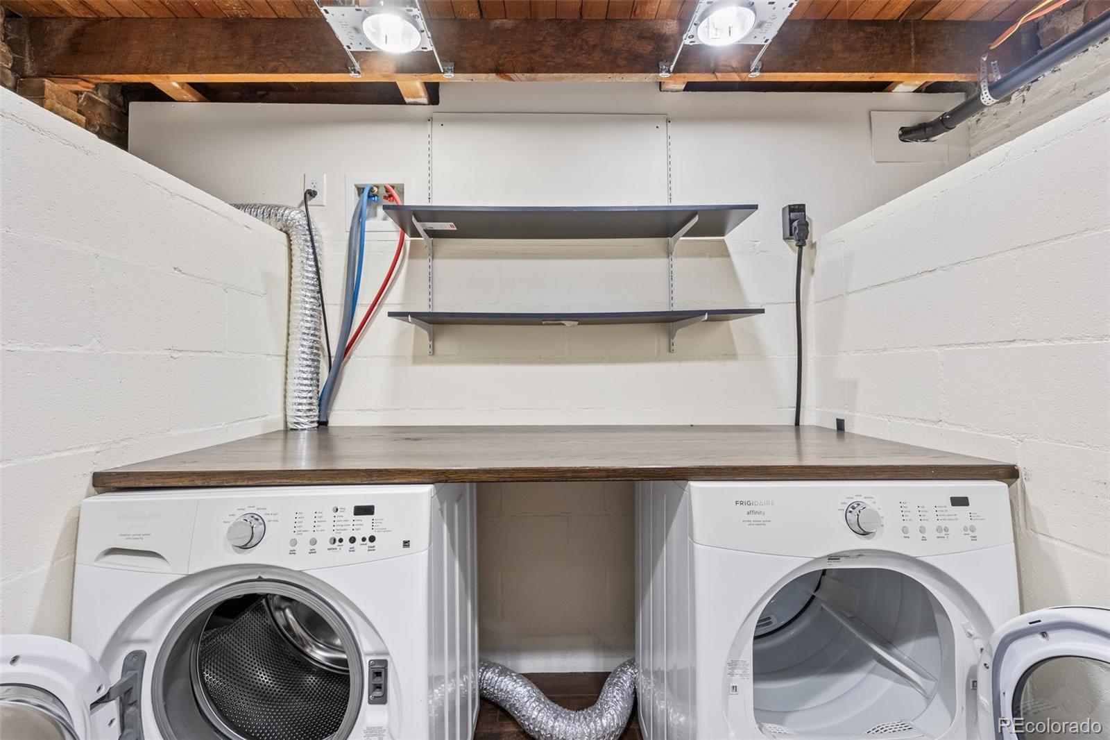 323 Inca Street Denver, CO 80223 - Photo 16 of 27 a view of entryway with washer and dryer