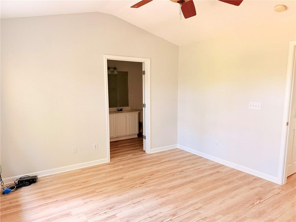 10900 Wittenridge Drive, Unit C7 Alpharetta, GA 30022 - Photo 19 of 31 a view of an empty room with wooden floor