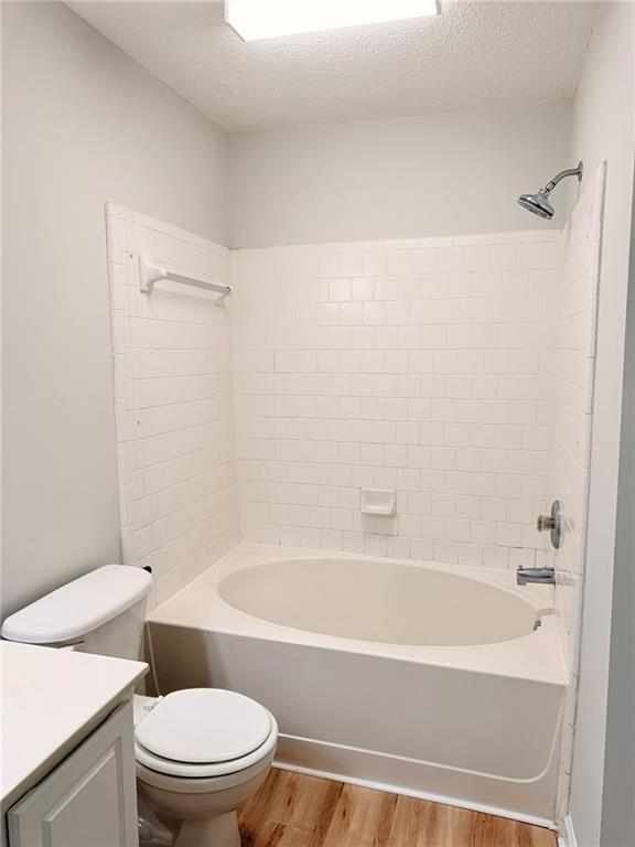 10900 Wittenridge Drive, Unit C7 Alpharetta, GA 30022 - Photo 20 of 31 a bathroom with a toilet and a bathtub