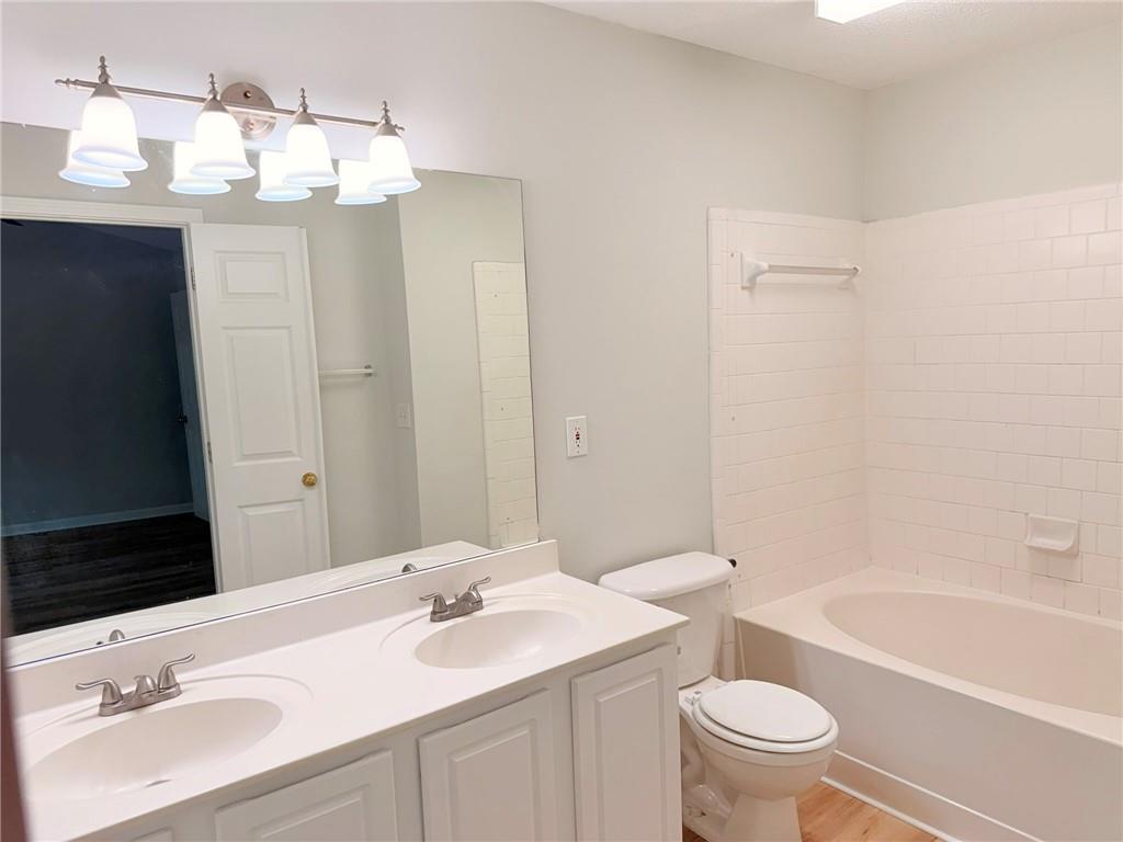 10900 Wittenridge Drive, Unit C7 Alpharetta, GA 30022 - Photo 21 of 31 a bathroom with a sink a toilet and bathtub