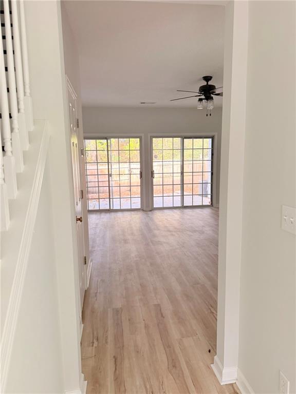 10900 Wittenridge Drive, Unit C7 Alpharetta, GA 30022 - Photo 29 of 31 wooden floor in an empty room with a window