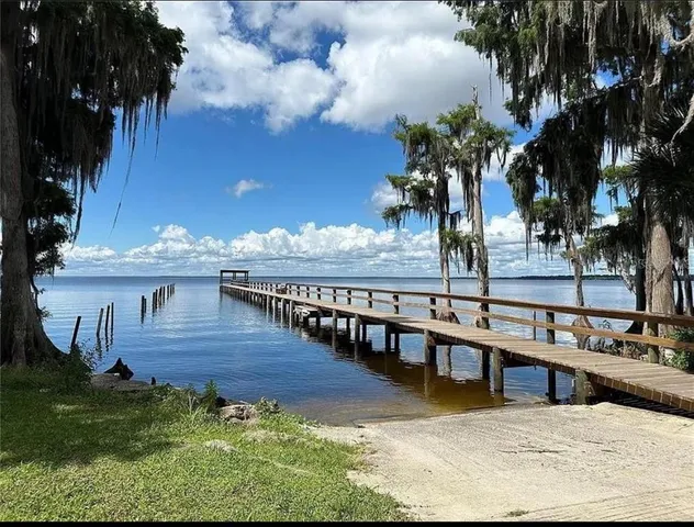 a view of a swimming pool with an outdoor seating