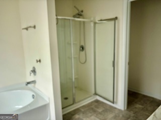 11899 Conrad Circle Hampton, GA 30228 - Photo 12 of 30 a bathroom with a glass shower door