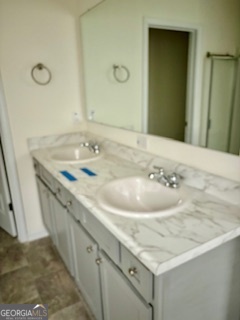 11899 Conrad Circle Hampton, GA 30228 - Photo 14 of 30 a bathroom with a sink and a mirror