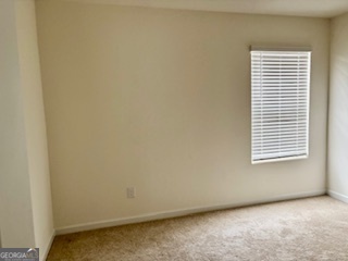 11899 Conrad Circle Hampton, GA 30228 - Photo 16 of 30 an empty room with a window
