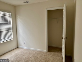 11899 Conrad Circle Hampton, GA 30228 - Photo 17 of 30 an empty room with windows