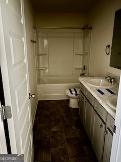 11899 Conrad Circle Hampton, GA 30228 - Photo 20 of 30 a bathroom with a granite countertop sink and a shower