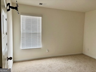 11899 Conrad Circle Hampton, GA 30228 - Photo 25 of 30 a view of a room that has a window in it