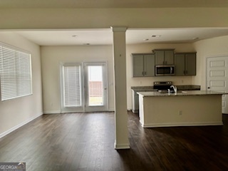 11899 Conrad Circle Hampton, GA 30228 - Photo 5 of 30 a view of kitchen with granite countertop cabinets and black stainless steel appliances