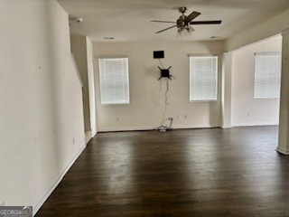 11899 Conrad Circle Hampton, GA 30228 - Photo 8 of 30 an empty room with wooden floor chandelier and windows