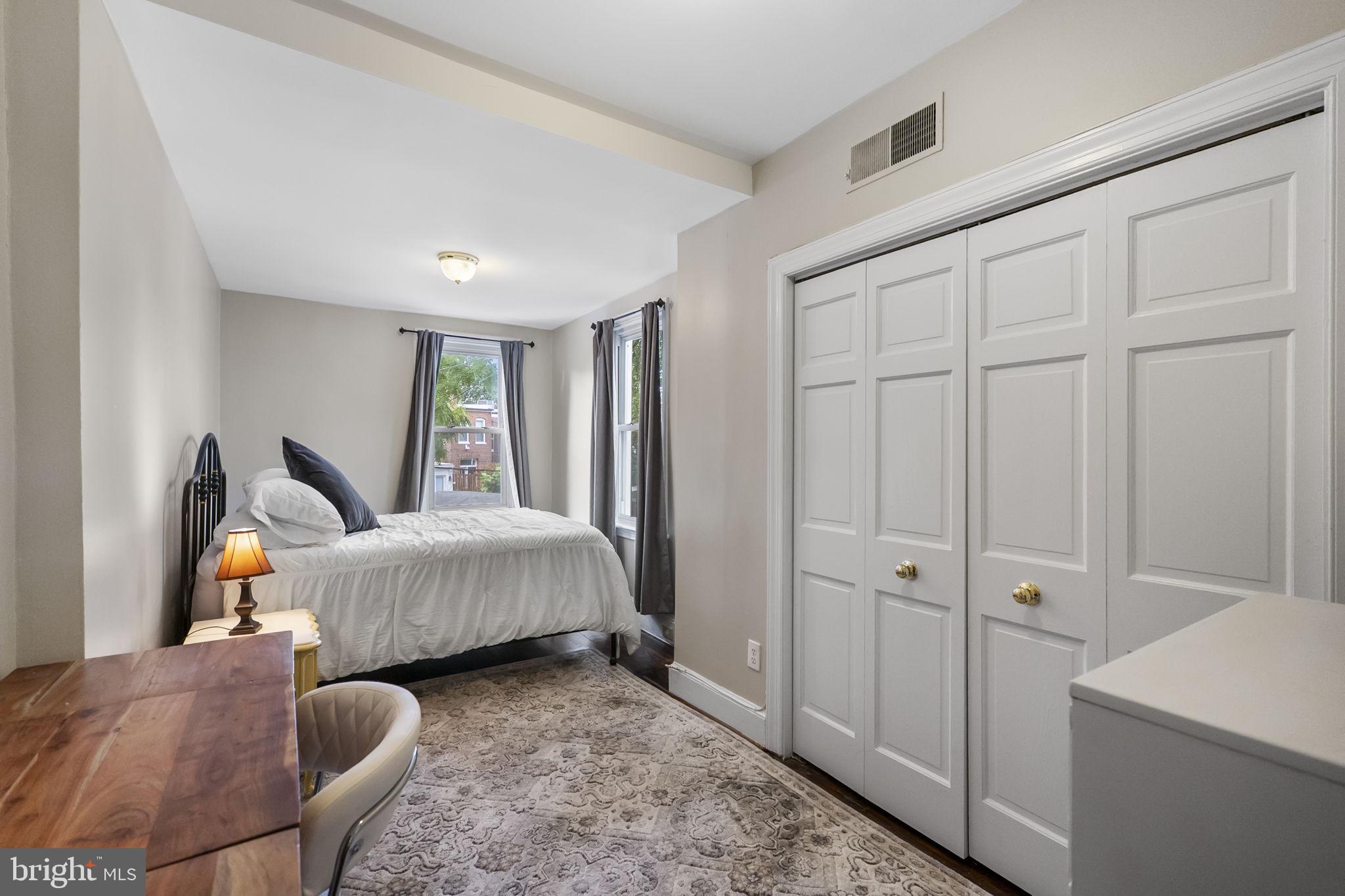 145 D Street Southeast Washington, DC 20003 - Photo 17 of 44 a spacious bedroom with a bed and large window