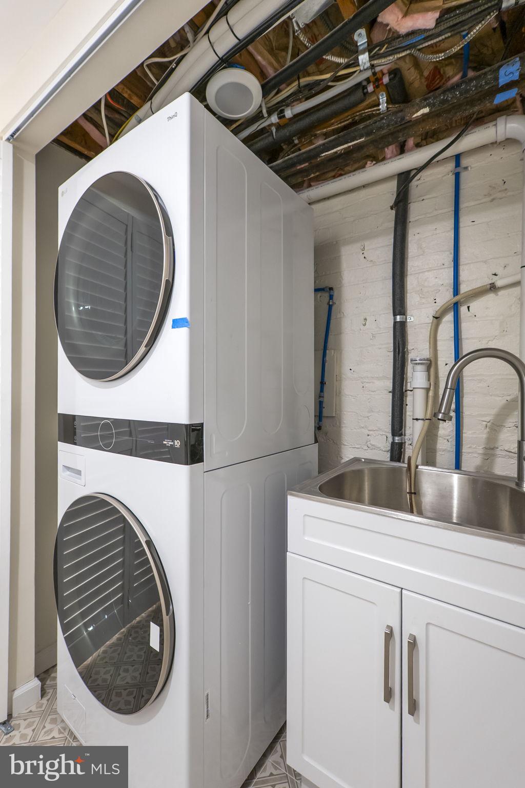 145 D Street Southeast Washington, DC 20003 - Photo 36 of 44 a utility room with dryer and washer