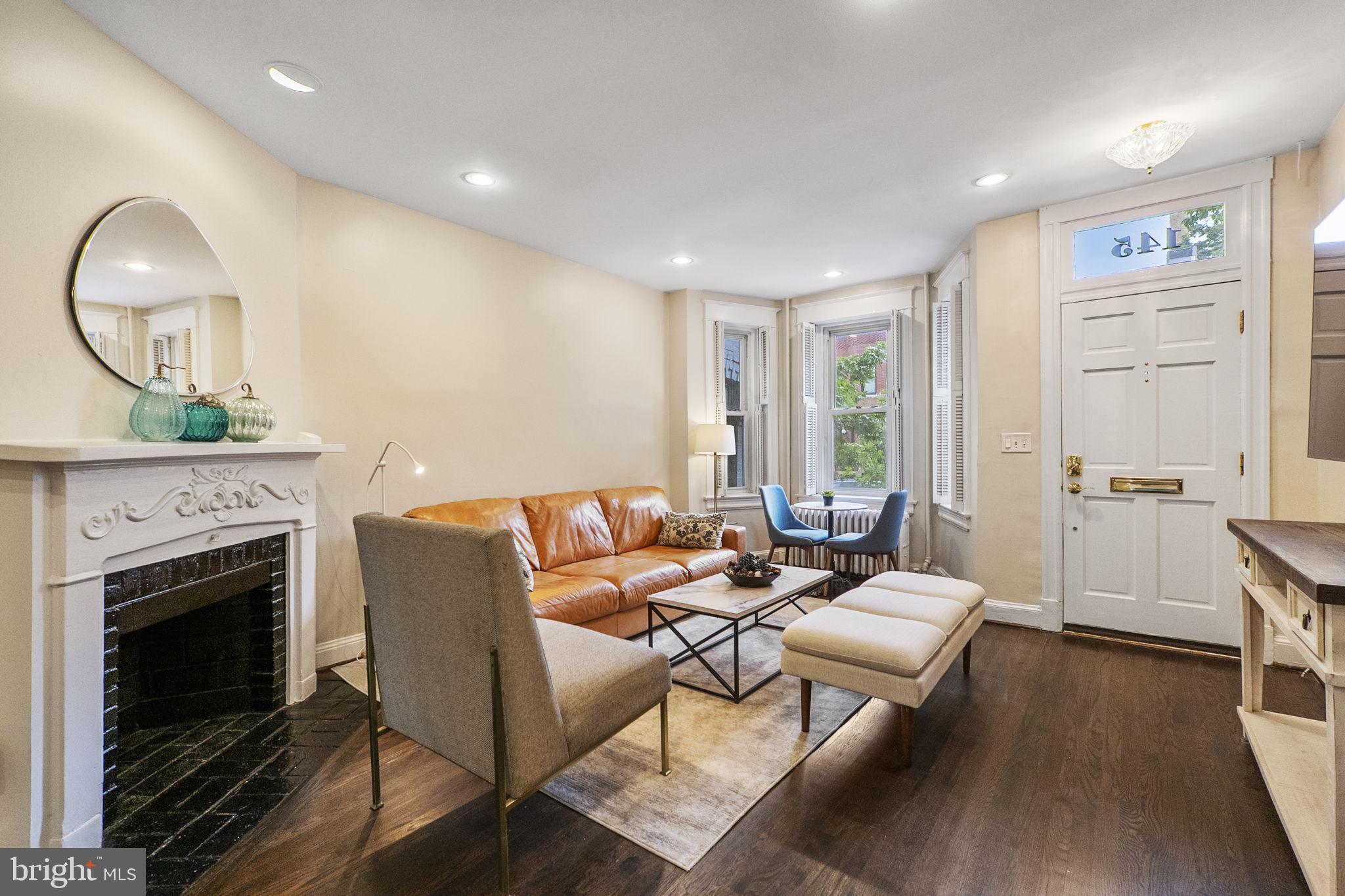 145 D Street Southeast Washington, DC 20003 - Photo 8 of 44 a living room with furniture and a fireplace