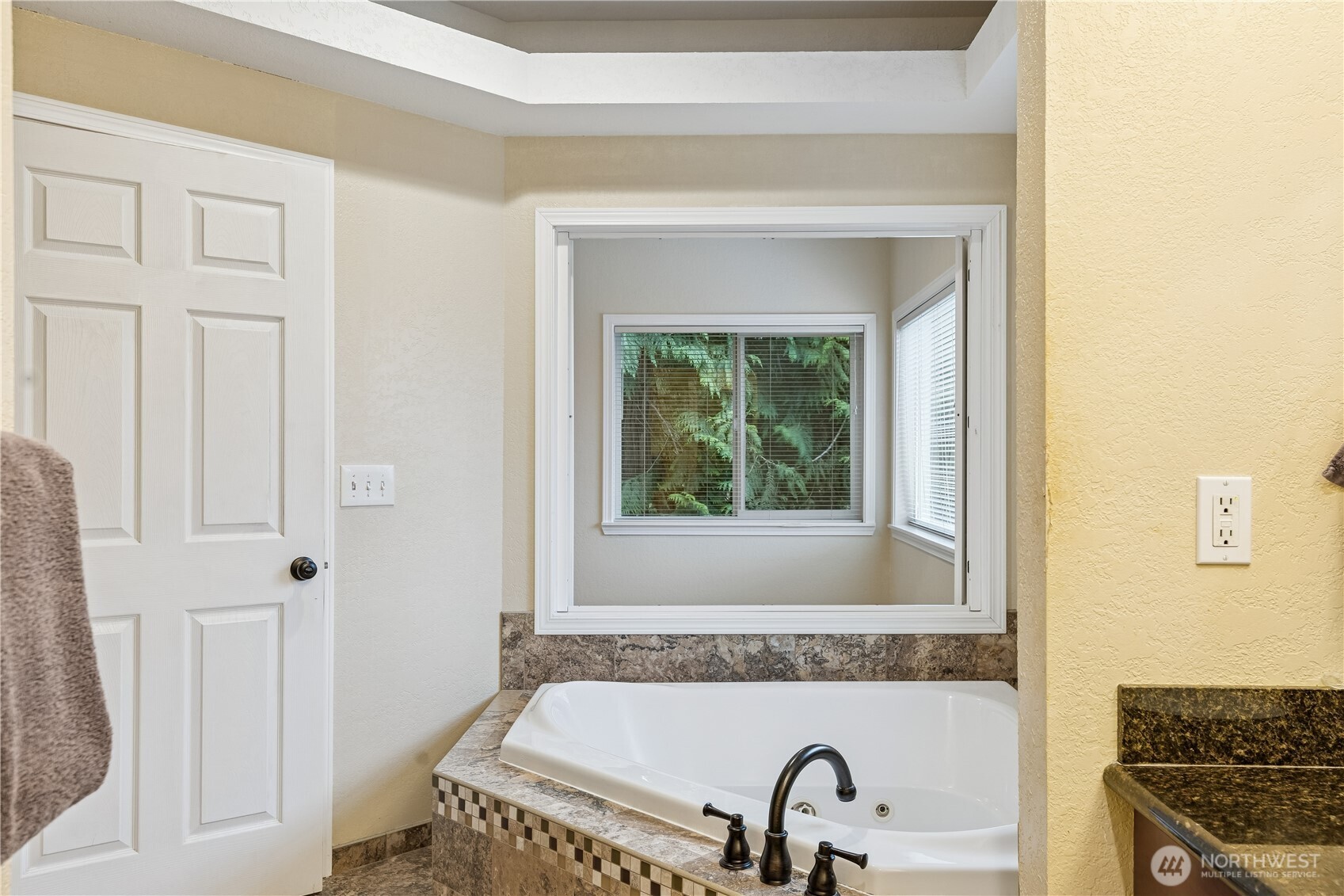2830 196th Street Southeast Bothell, WA 98012 - Photo 13 of 18 a bathroom with a sink and a bathtub