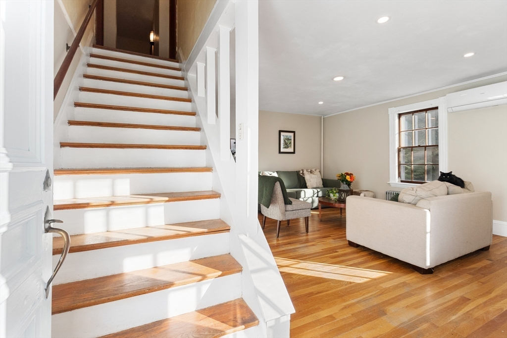 34 Chestnut Street Danvers, MA 01923 - Photo 12 of 33 a living room with furniture and a floor to ceiling window