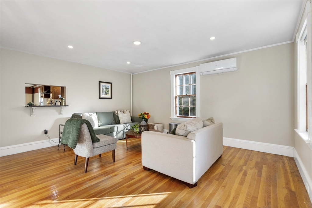 34 Chestnut Street Danvers, MA 01923 - Photo 15 of 33 a living room with furniture and a rug
