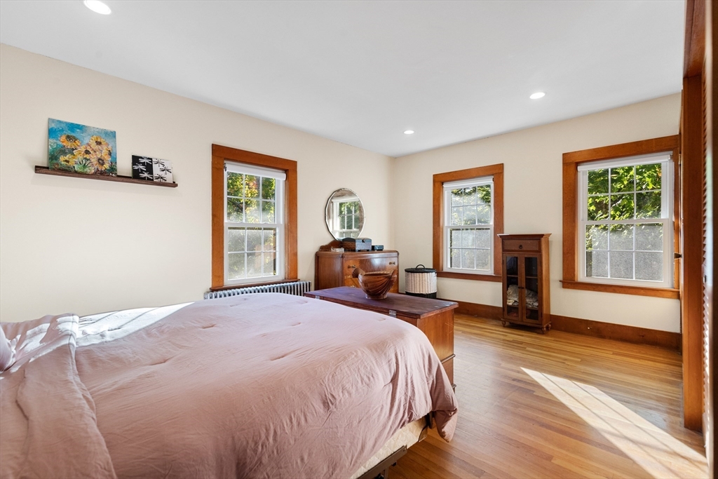 34 Chestnut Street Danvers, MA 01923 - Photo 16 of 33 a spacious bedroom with a bed and wooden floor