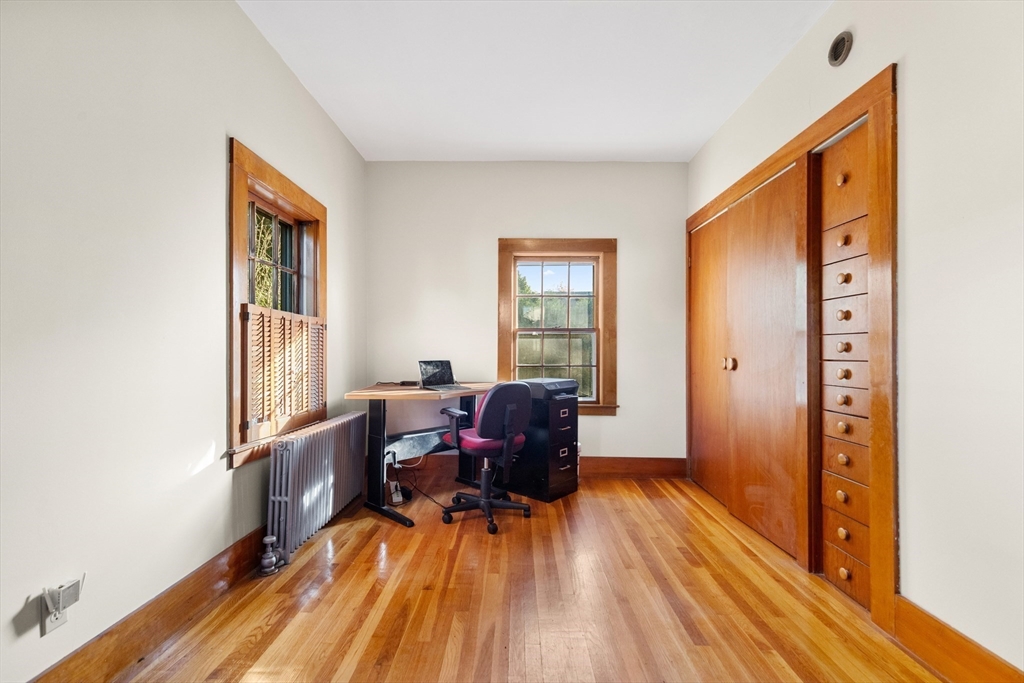 34 Chestnut Street Danvers, MA 01923 - Photo 19 of 33 a workspace with wooden floor and furniture