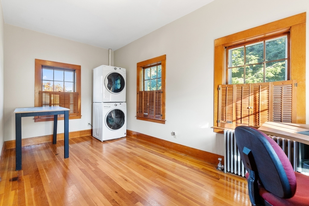 34 Chestnut Street Danvers, MA 01923 - Photo 25 of 33 a view of an empty room with wooden floor and a window