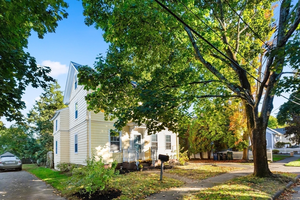 34 Chestnut Street Danvers, MA 01923 - Photo 6 of 33 a front view of a house with a yard and large trees