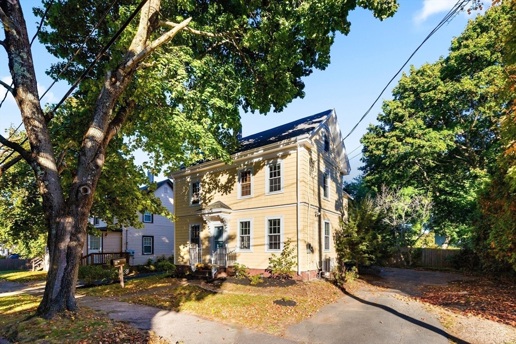 34 Chestnut Street Danvers, MA 01923 - Photo 7 of 33 a view of a white house with a large tree