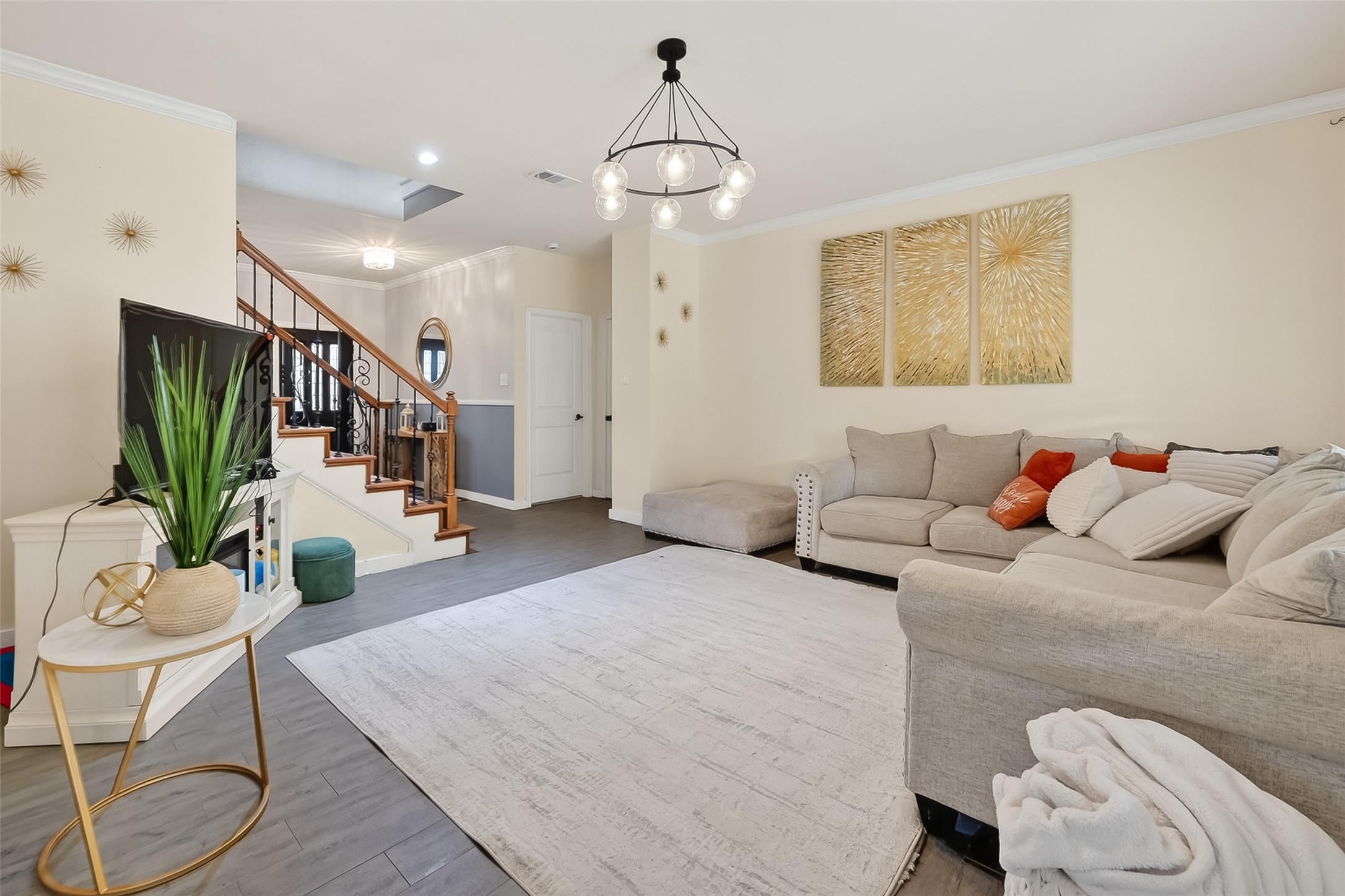 14955 Inverrary Drive Houston, TX 77095 - Photo 11 of 46 a living room with furniture chandelier and a flat screen tv