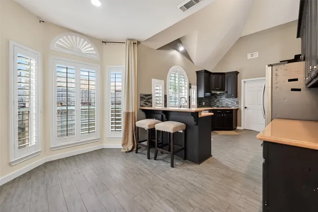 a bathroom with a bathtub and shower
