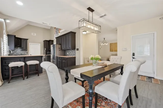 an aerial view of a golf course with parking space