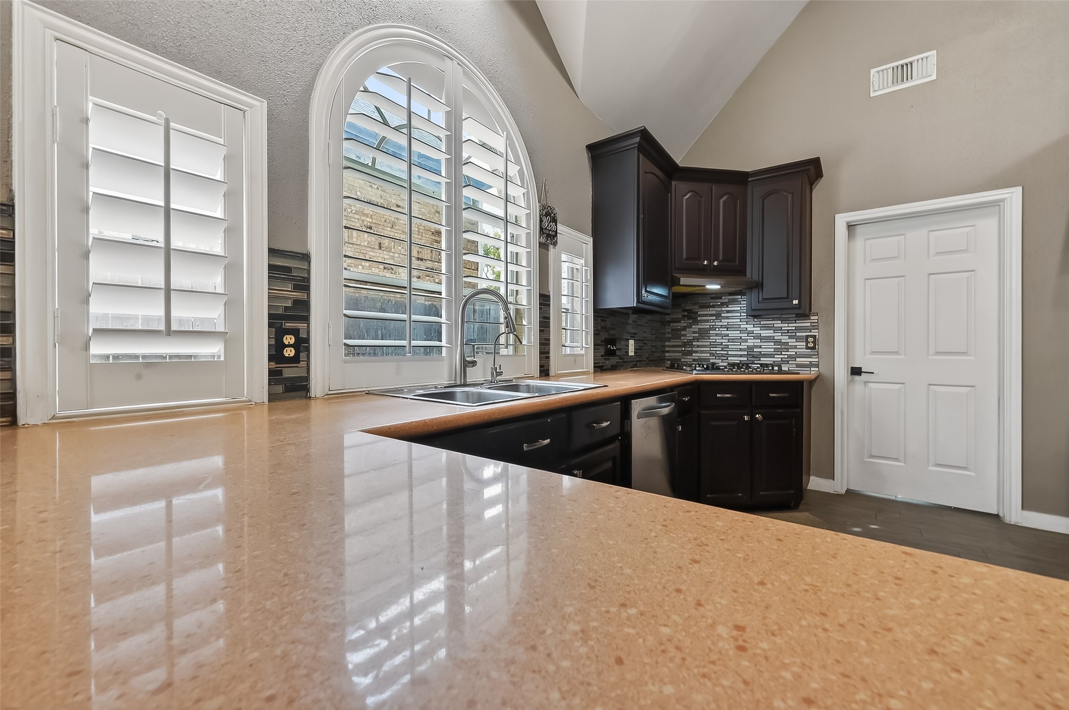 14955 Inverrary Drive Houston, TX 77095 - Photo 19 of 46 a kitchen with granite countertop a stove and a sink