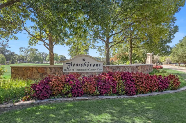 a living room with furniture a fireplace and a large window