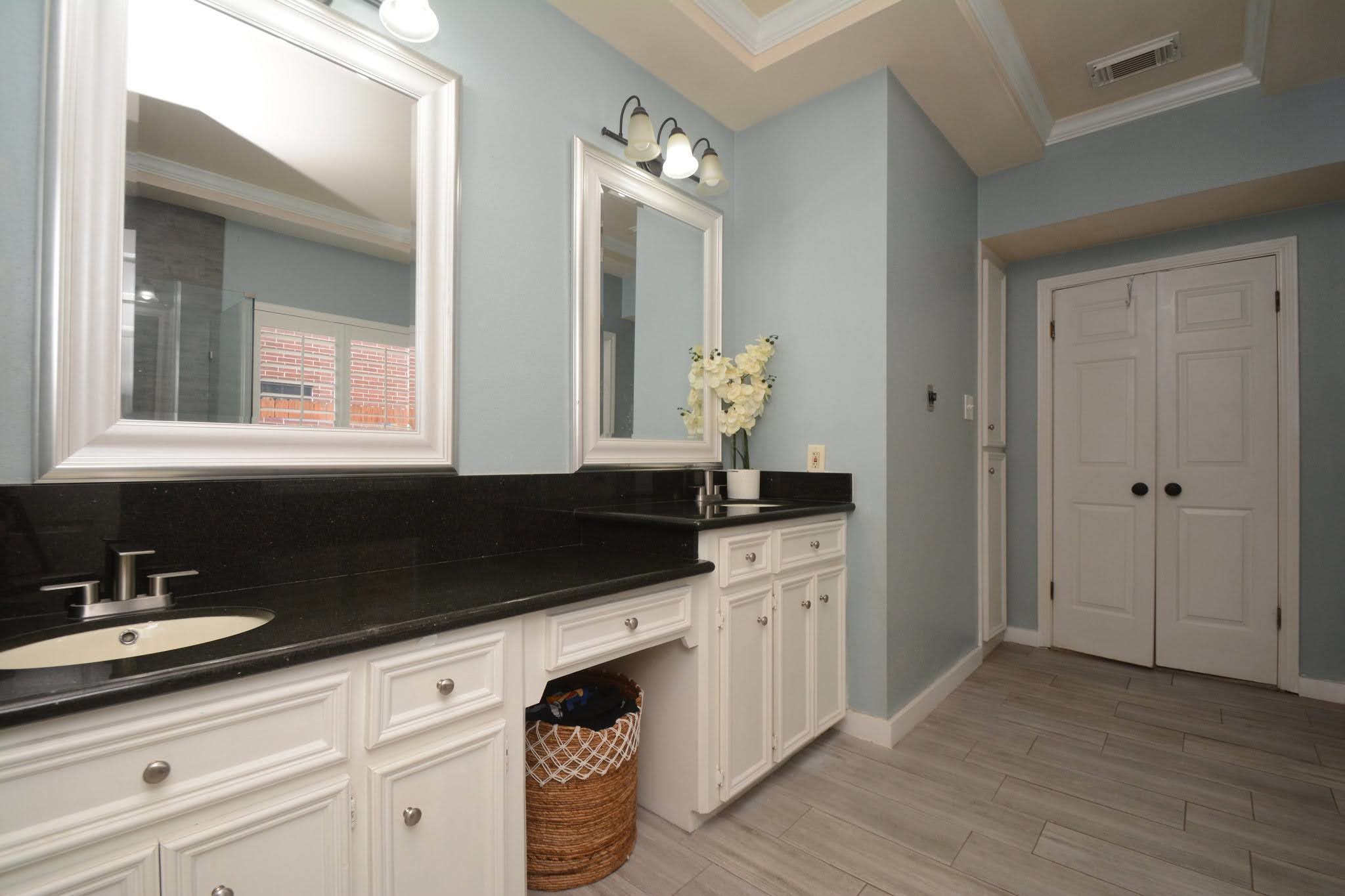 14955 Inverrary Drive Houston, TX 77095 - Photo 22 of 46 a bathroom with a sink and a mirror