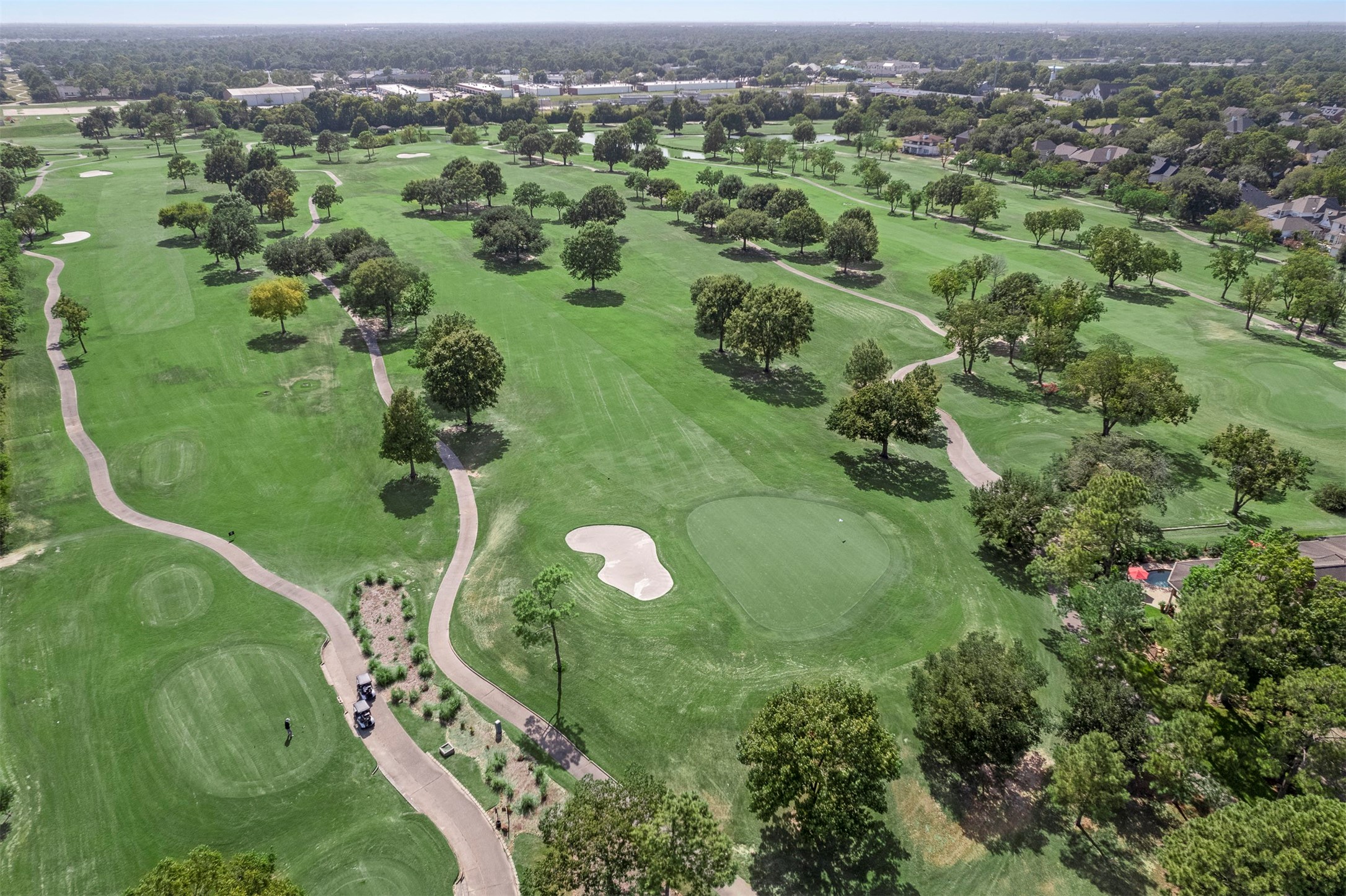 14955 Inverrary Drive Houston, TX 77095 - Photo 25 of 46 an aerial view of a golf course with parking space
