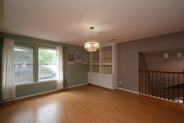 an aerial view of a houses with a big yard