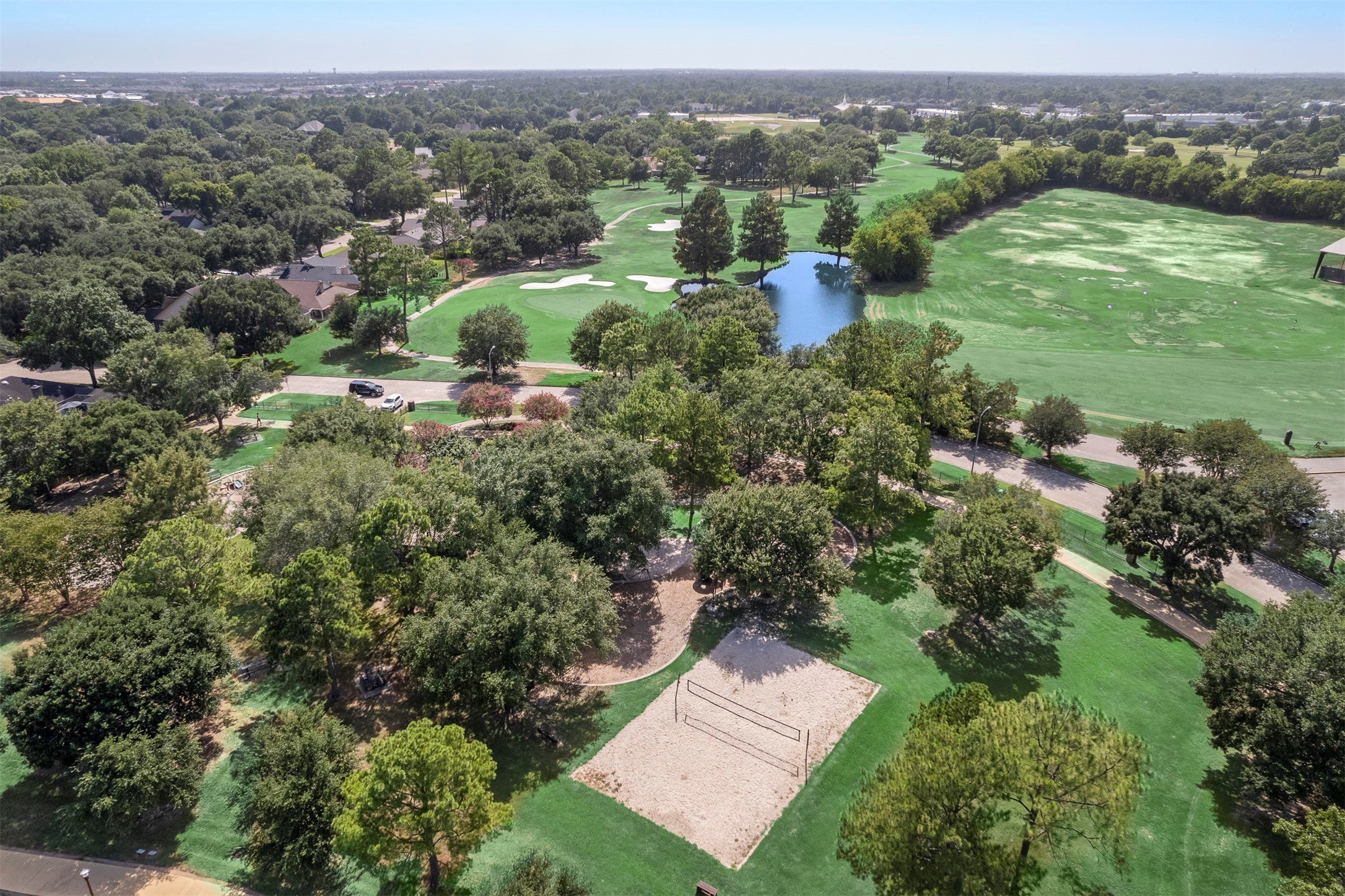 14955 Inverrary Drive Houston, TX 77095 - Photo 38 of 46 an aerial view of green landscape with trees houses and mountain view