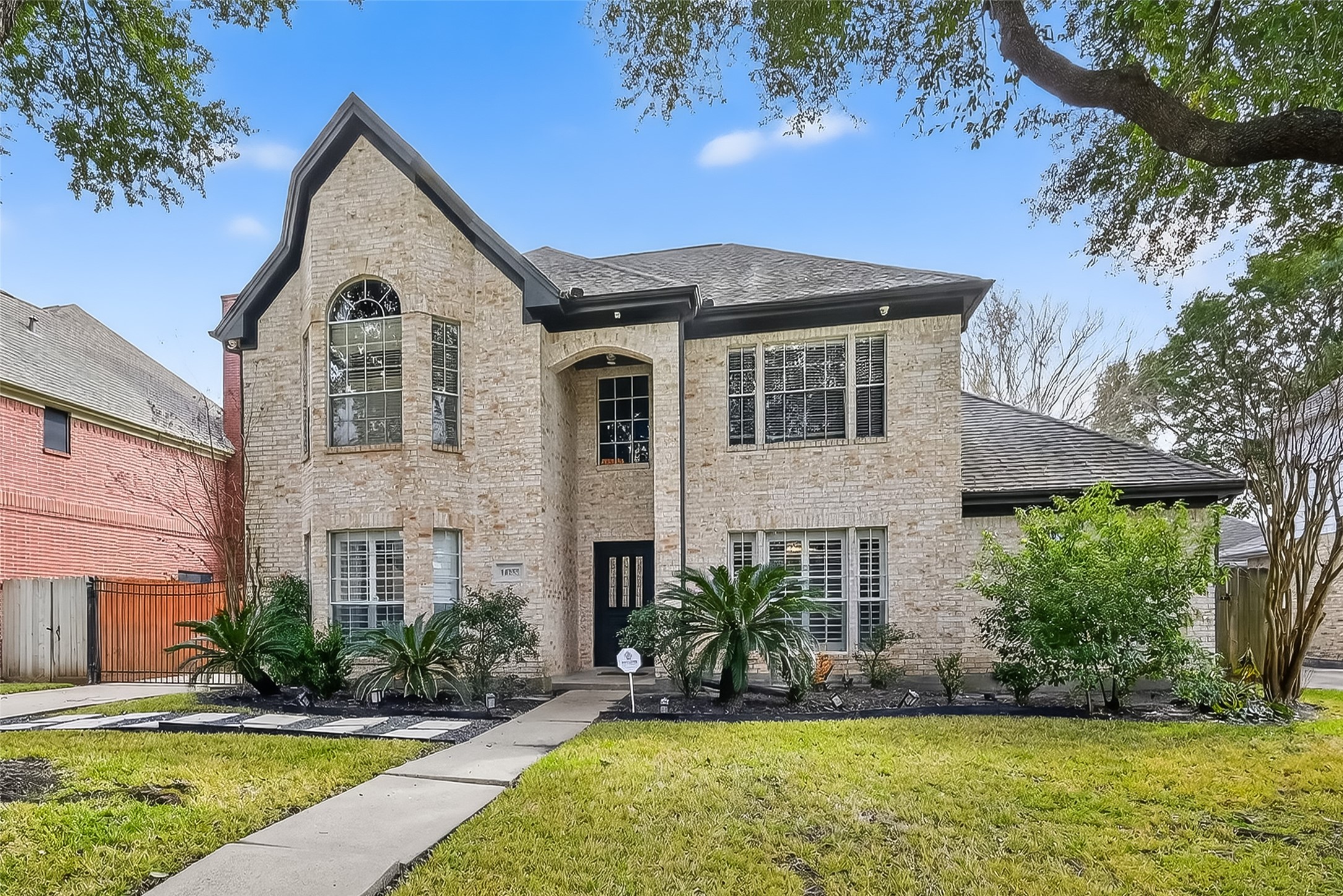 14955 Inverrary Drive Houston, TX 77095 - Photo 41 of 46 a front view of a house with a yard