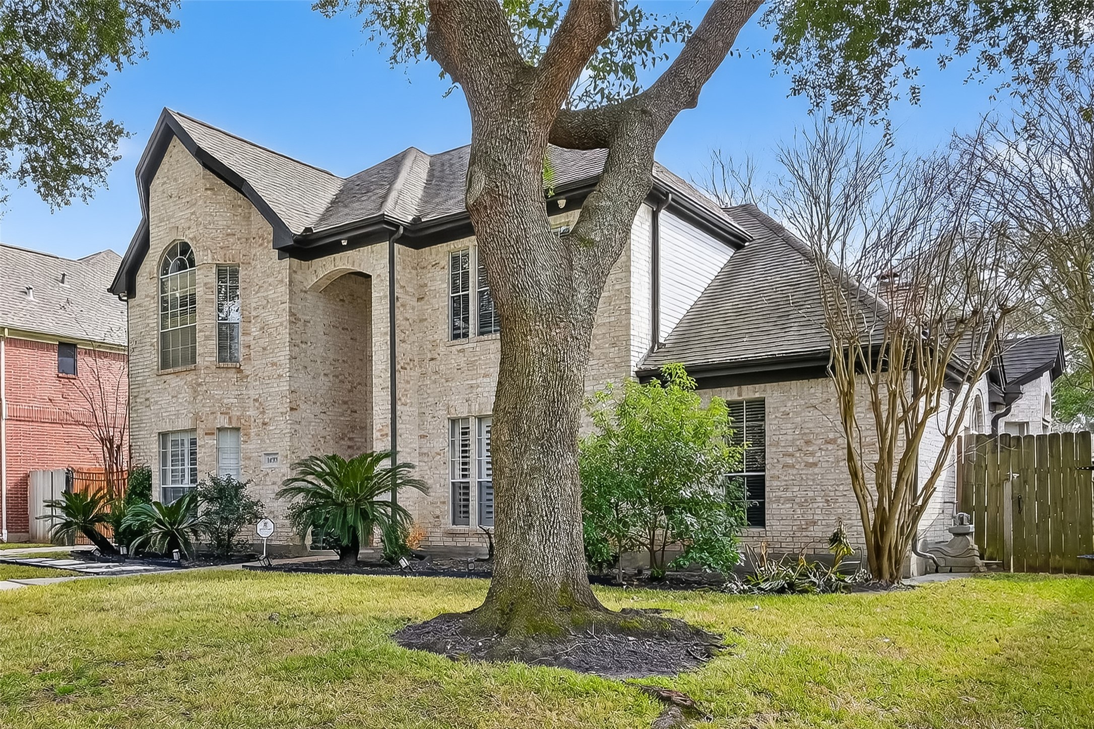 14955 Inverrary Drive Houston, TX 77095 - Photo 42 of 46 a front view of a house with a yard