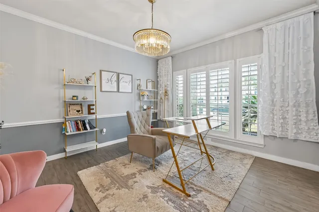 a view of a livingroom with furniture window and wooden floor