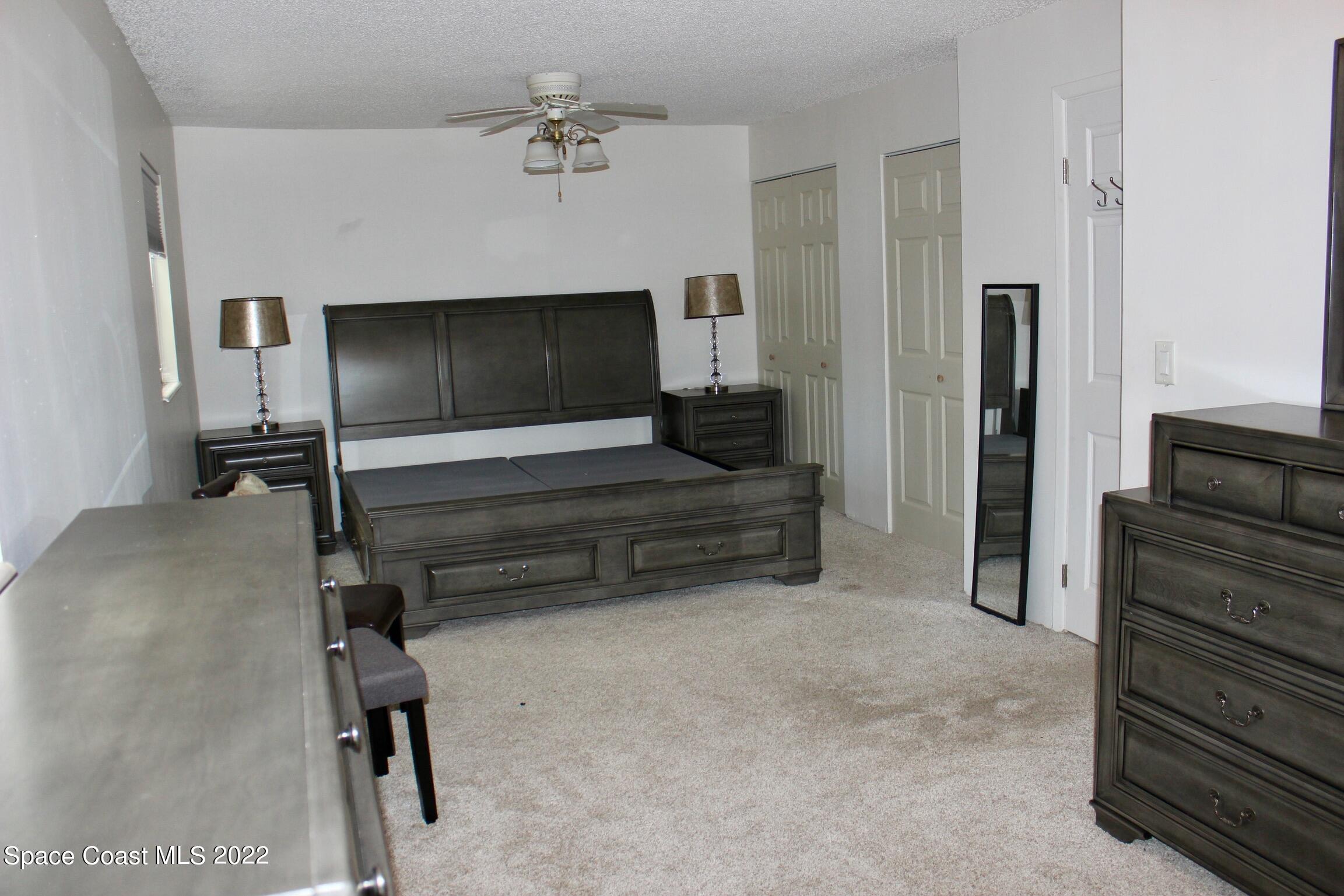 3665 Burkholm Road Mims, FL 32754 - Photo 27 of 62 a living room with furniture and a flat screen tv