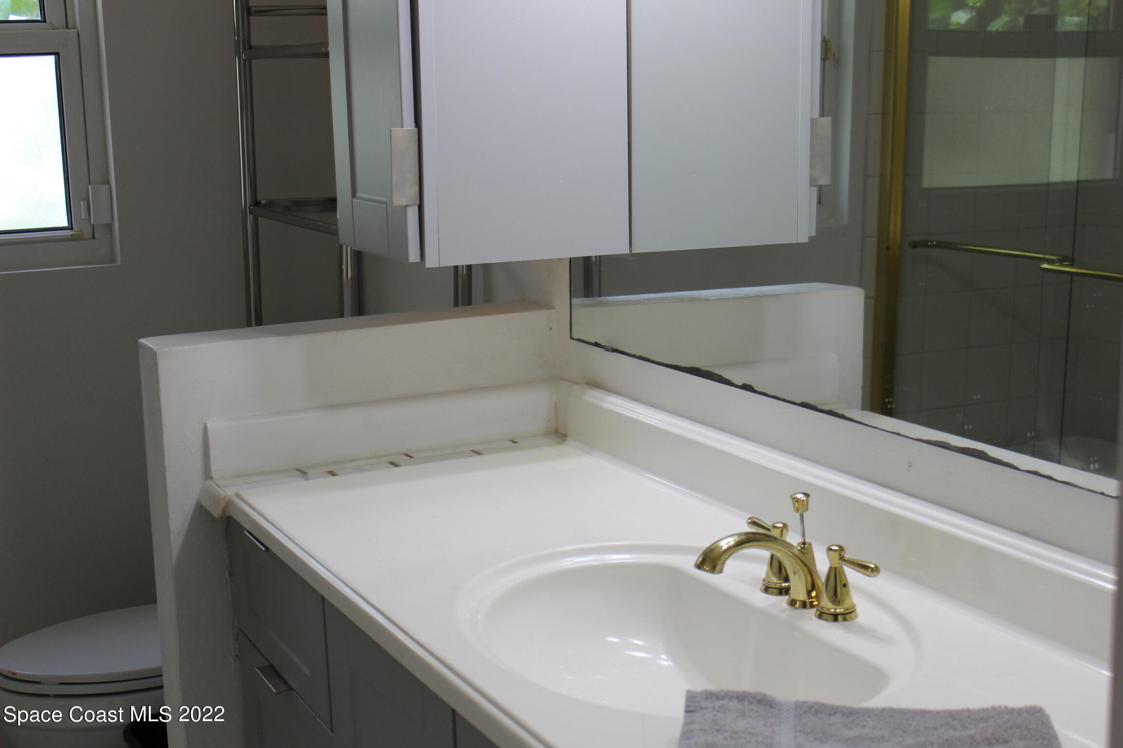 3665 Burkholm Road Mims, FL 32754 - Photo 28 of 62 a bathroom with a bathtub and shower