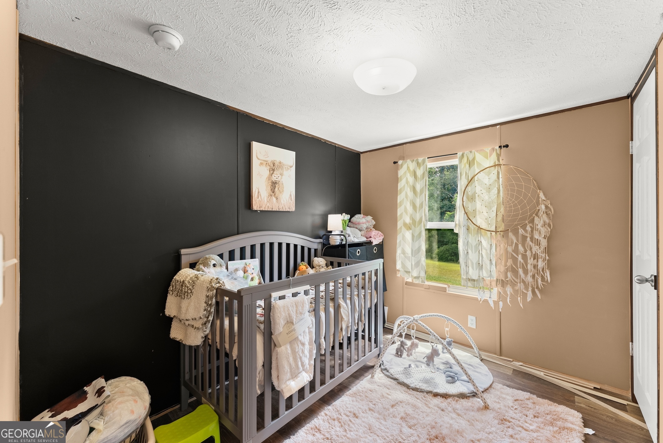 303 Blakely Chappelear Road Martin, GA 30557 - Photo 12 of 20 a bedroom with furniture and a window