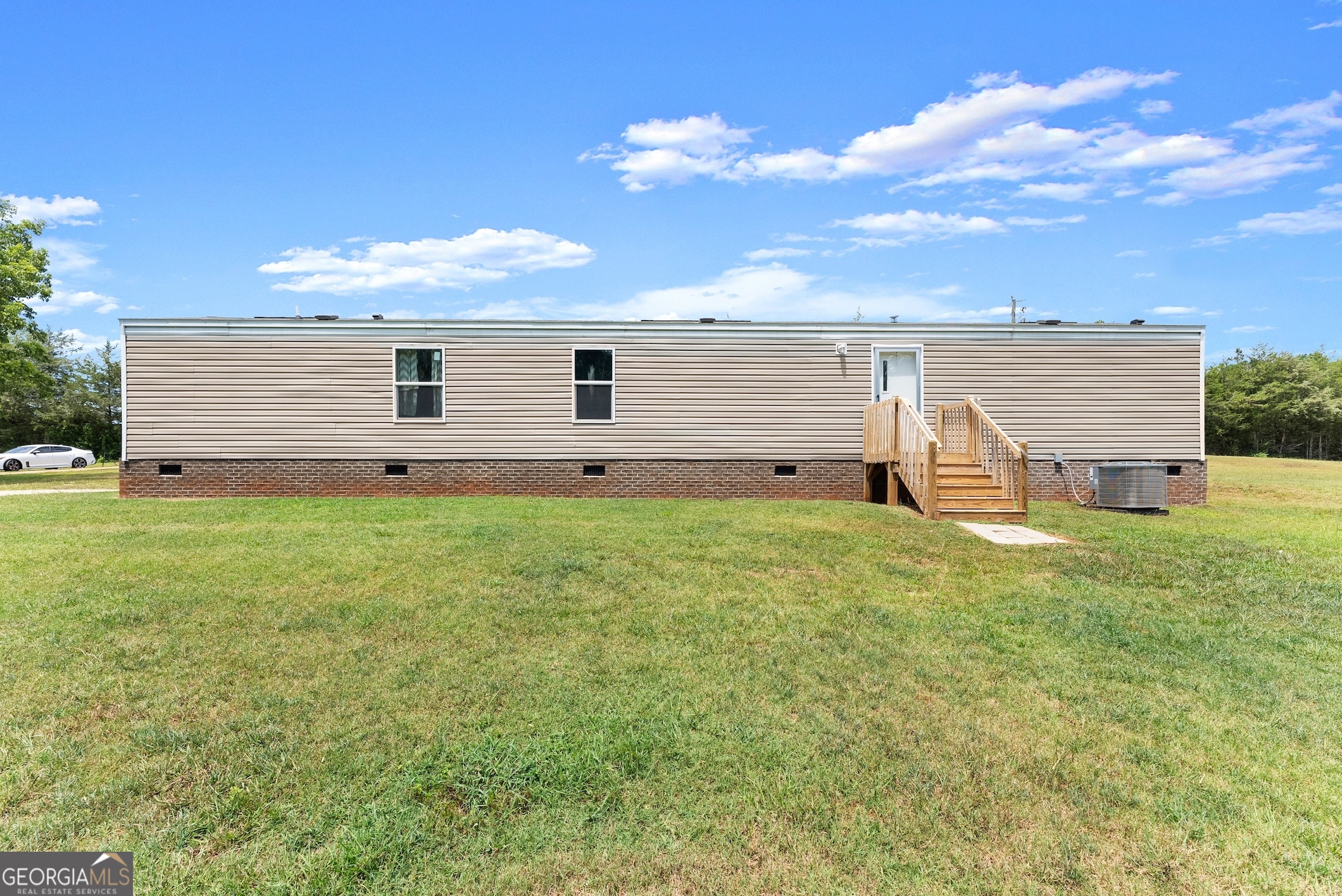 303 Blakely Chappelear Road Martin, GA 30557 - Photo 15 of 20 a backyard of a house with table and chairs